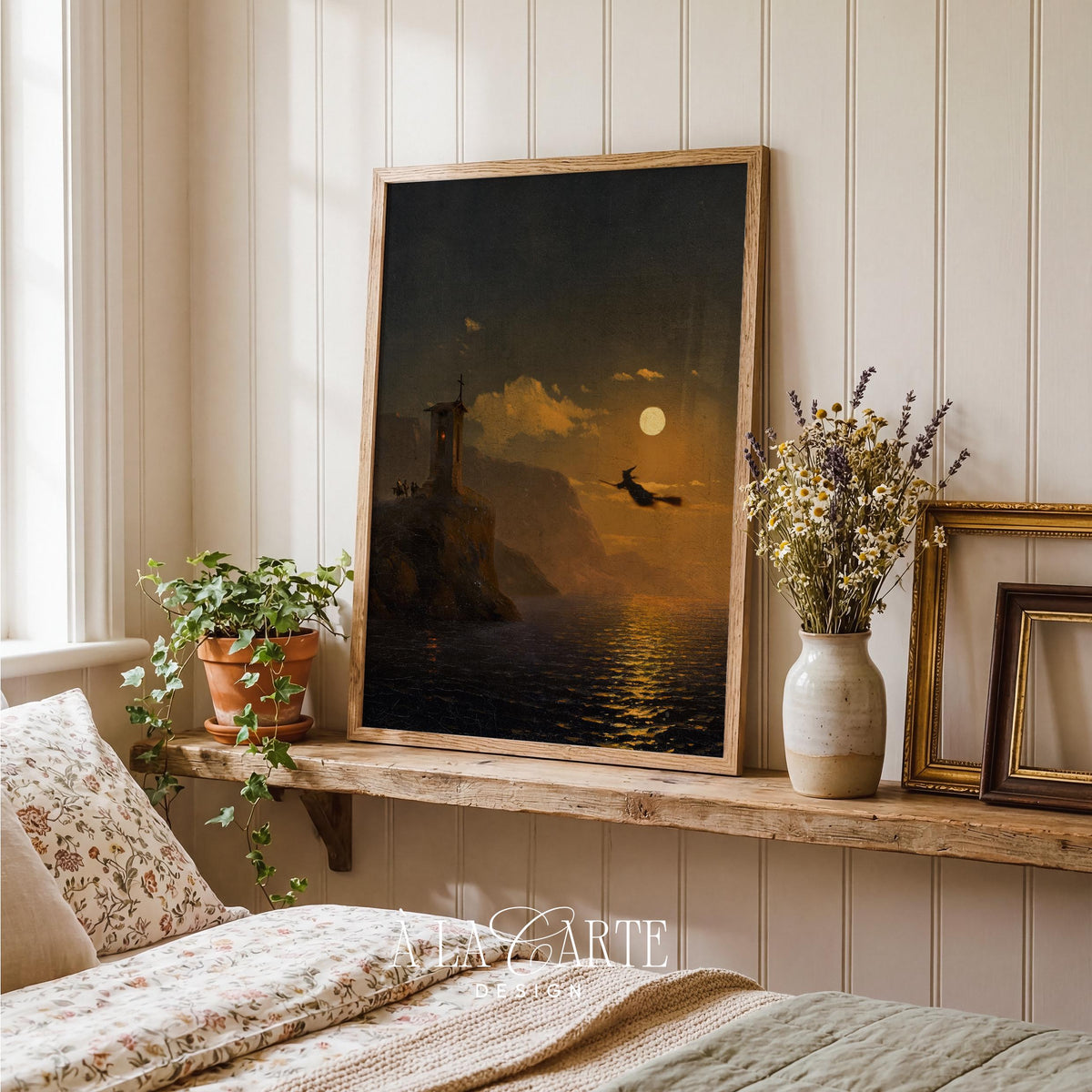 Silhouette sorceress soaring night sky wall art — moody dark atmospheric seaside landscape digital print with glowing moon