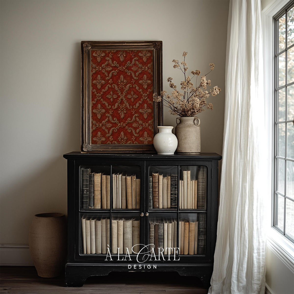 Historic brocade wall decor featuring symmetrical crimson medallions with gilded ornamental detailing and scrolls