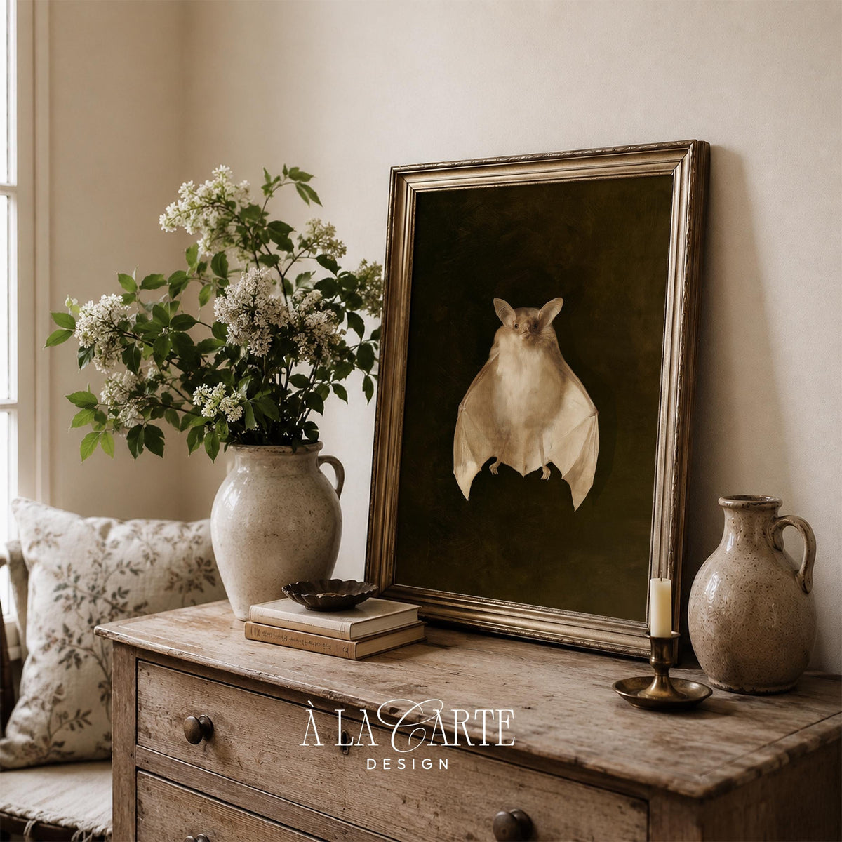 Symmetrical bat figure painting for dark academia decor — creamy tones against deep olive-black backdrop