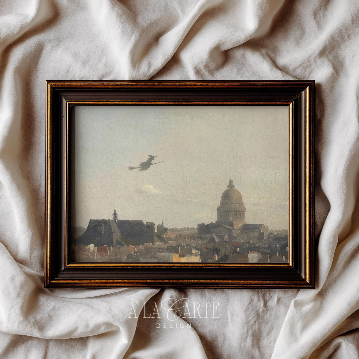Witch flying on broomstick poster — vintage cityscape silhouette with moody golden-gray sky and historic landmarks