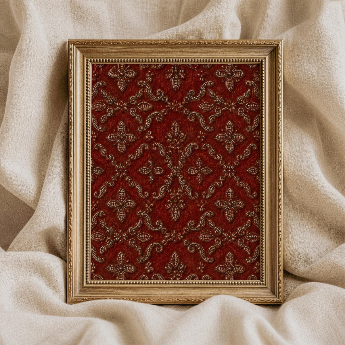 Regal tapestry artwork showcasing deep red all-over damask pattern with gold-toned beaded frame accents