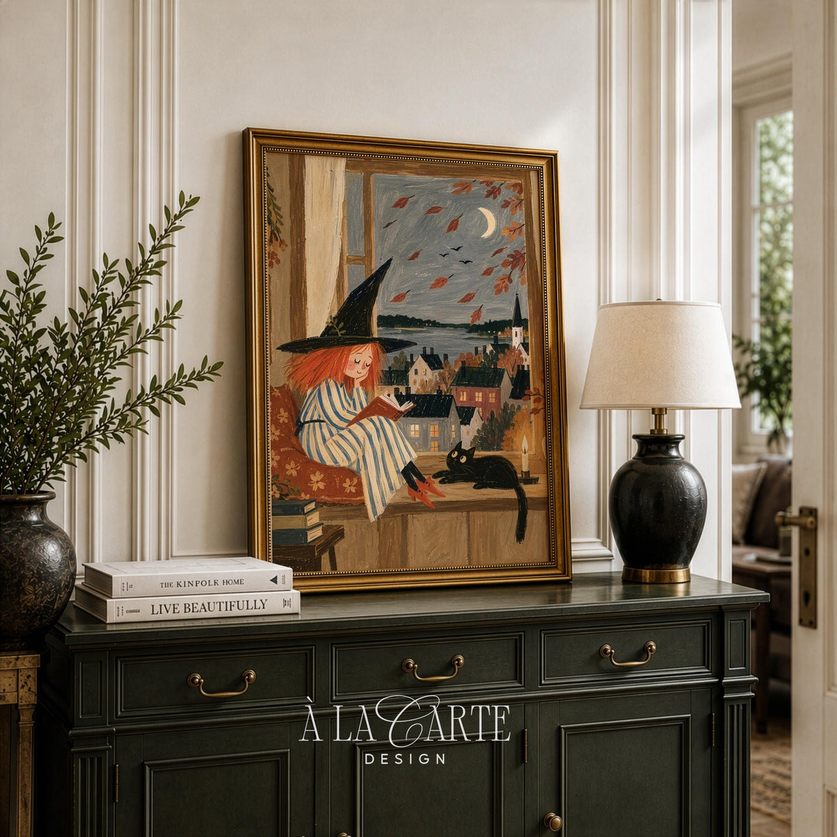 Autumn armchair scene poster — printable folk-style illustration of witch reading with black cat, moon, and village view through glass