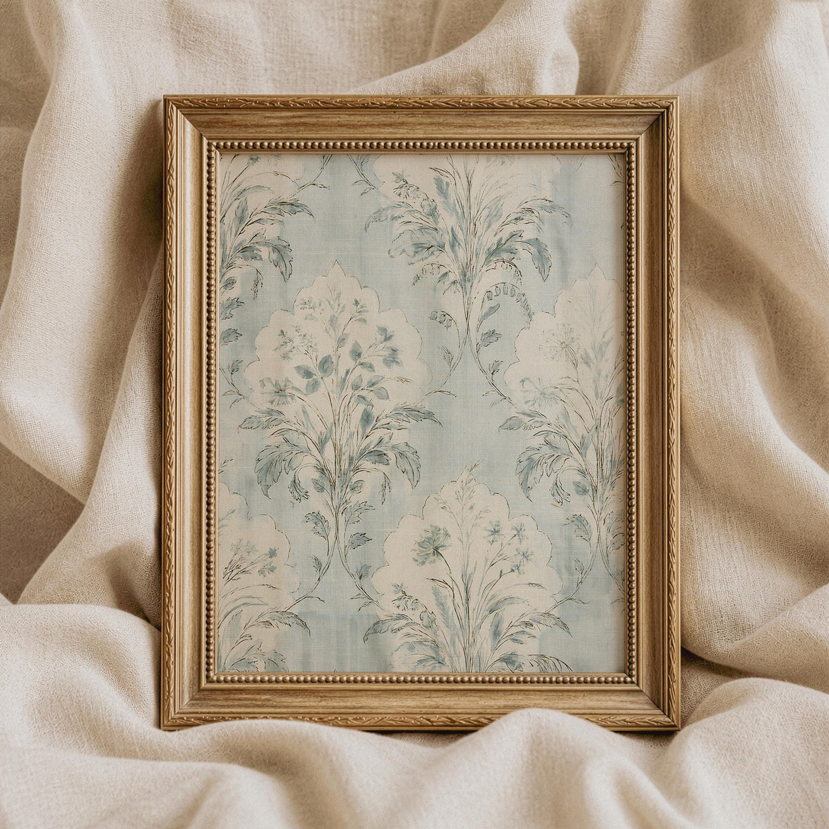 Blue floral heritage artwork featuring aged fabric appearance and romantic damask motifs