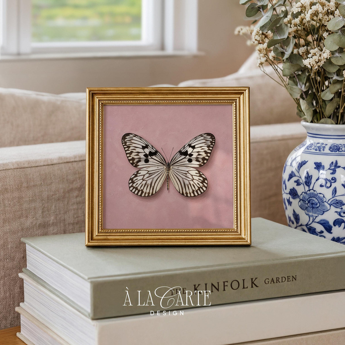 Vintage butterfly printable art for nursery — black and white patterned wings on soft blush background