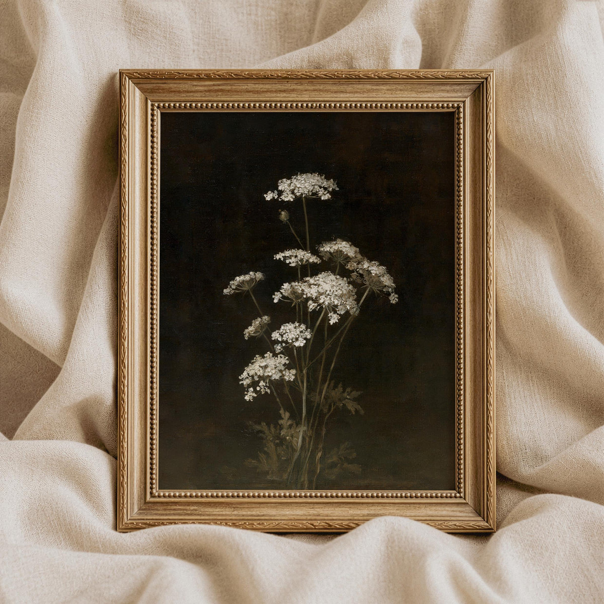 Botanical wall picture for study — pale flower clusters against near-black background with aged patina finish
