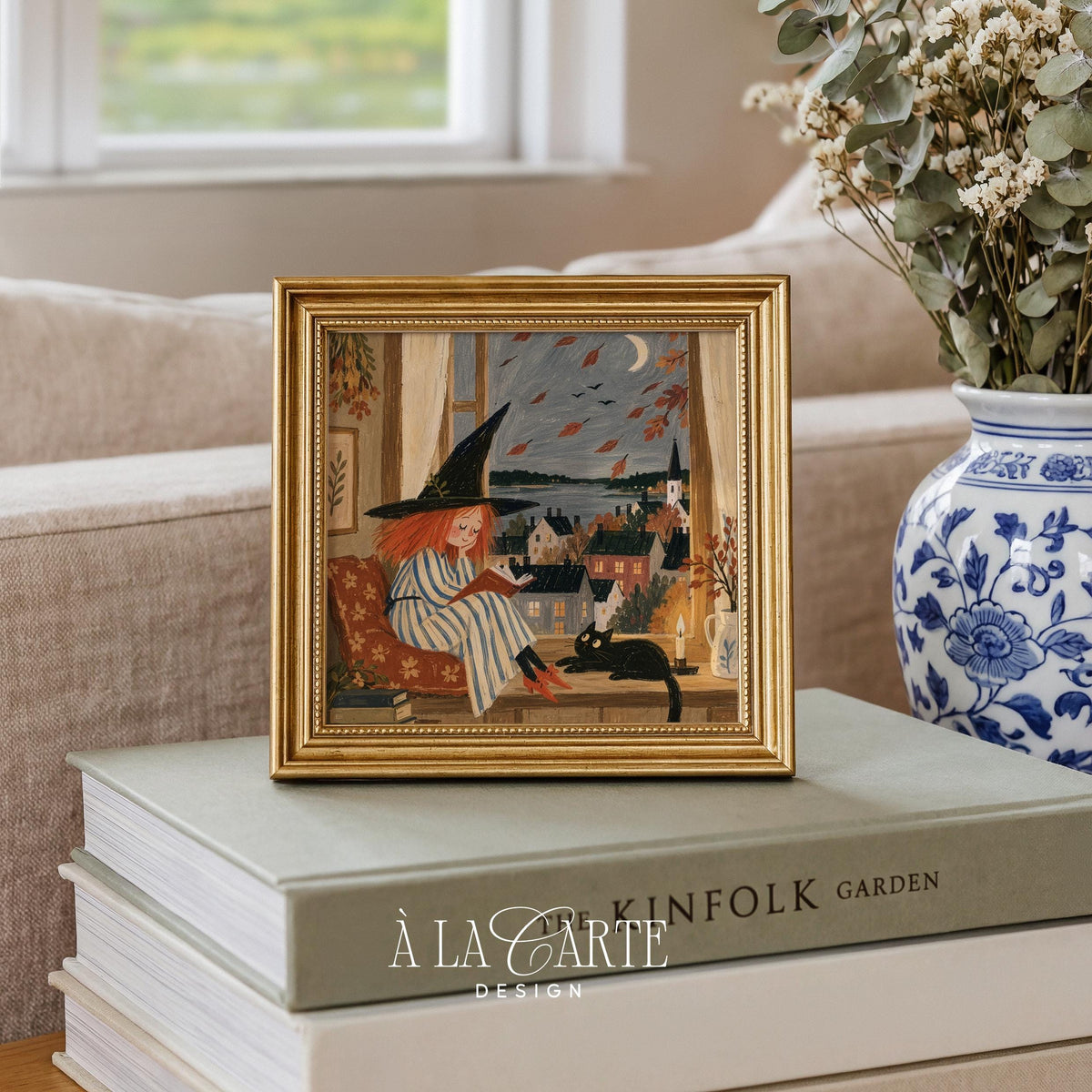 Folk-style woman reading digital art for gallery wall — charming autumn print with black pet, candle, and coastal window landscape