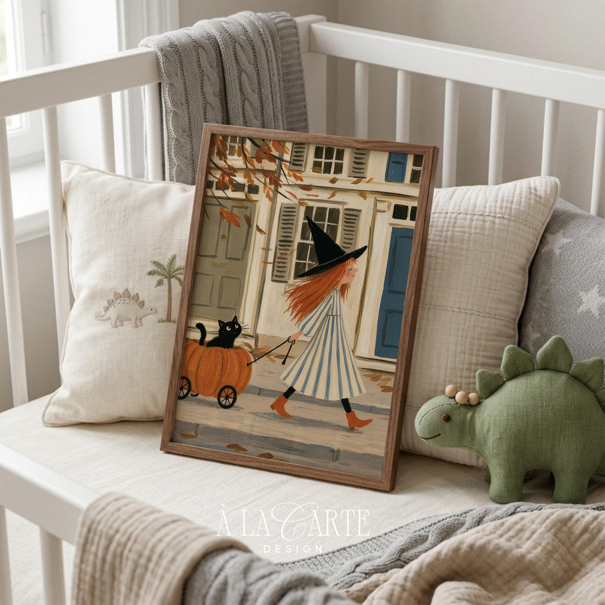 Red-haired witch poster pulling pumpkin cart with black cat down cobblestone village street