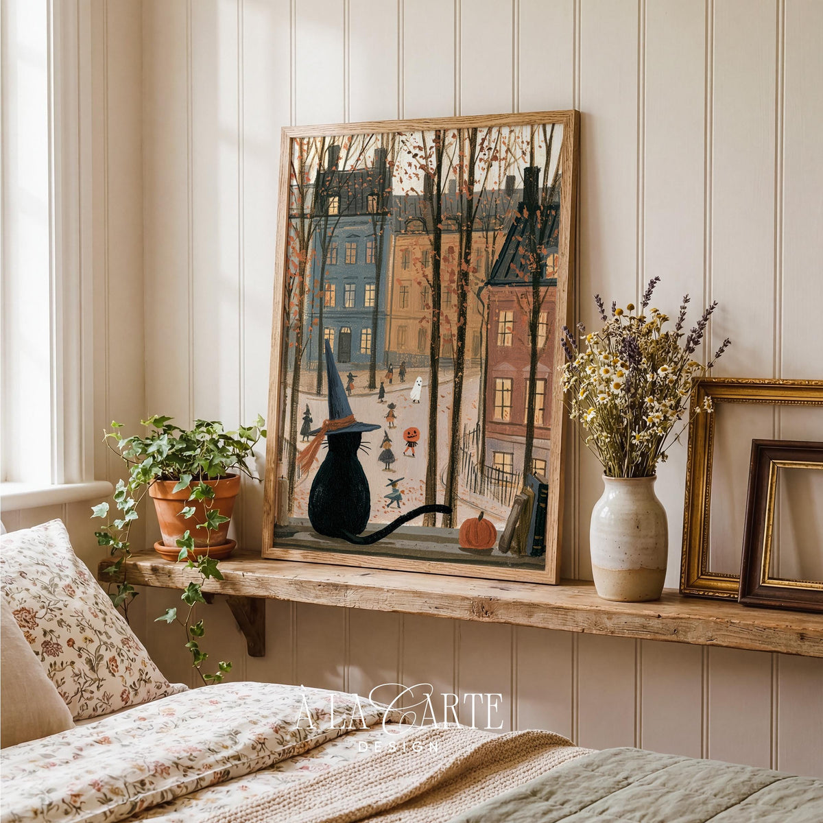 Cat on window ledge digital print for entryway — festive seasonal artwork featuring trick-or-treaters below