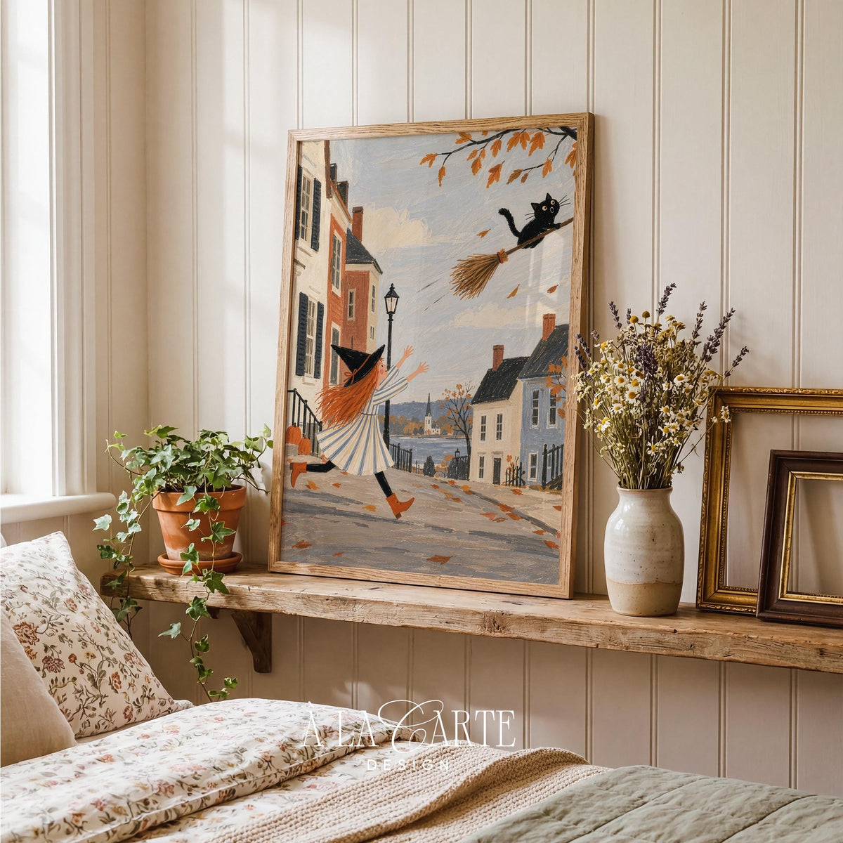 Halloween broomstick adventure poster for nursery — soft spooky charm with black cat and charming small-town scenery