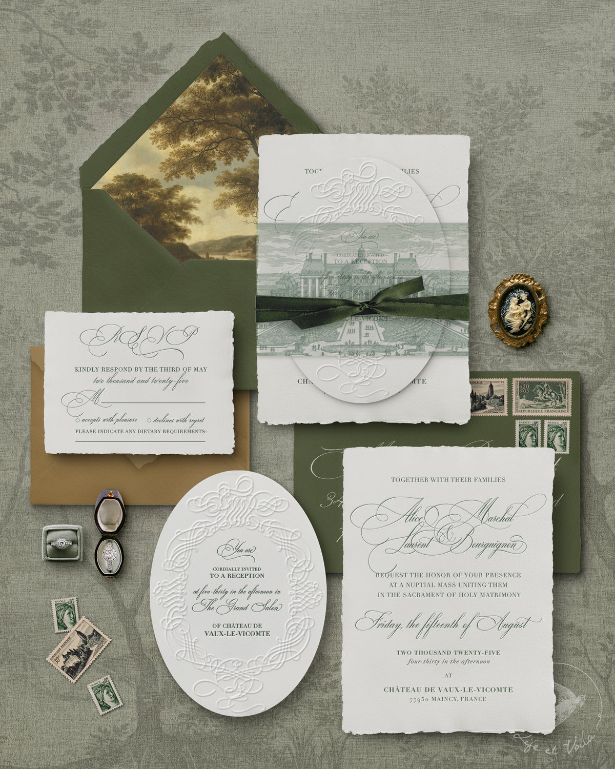 The Sage Symfony is a luxury wedding invitation suite design with sage green envelopes, baroque-inspired details, antique tapestry vellum wrap, elegant calligraphy, custom venue illustration, monogram envelope liner by Life et Voila